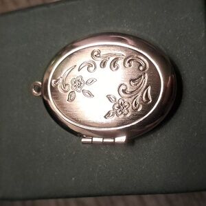 Vintage Avon Silver Tone Floral Engraved Locket.